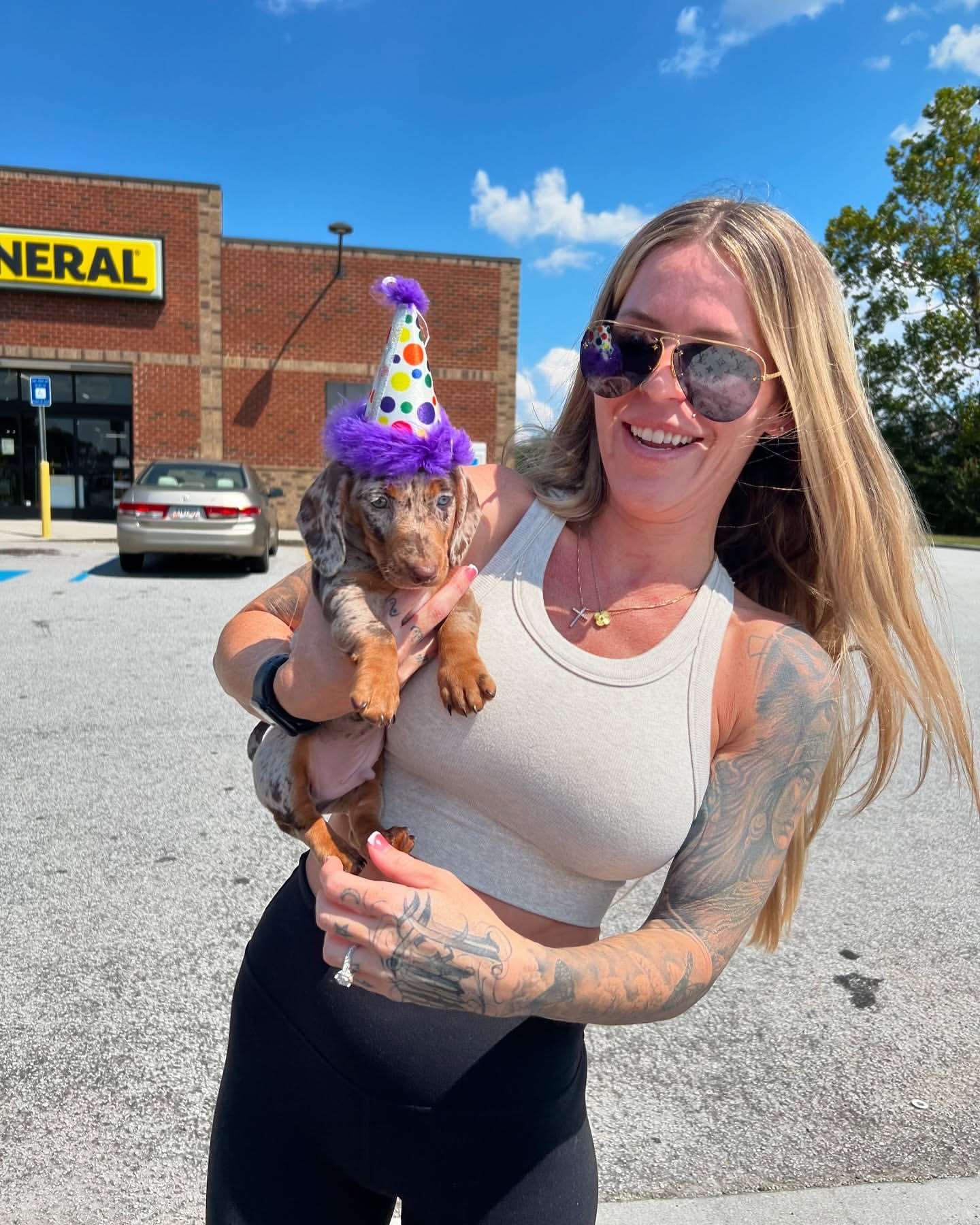 Happy family with their Dachshund puppy