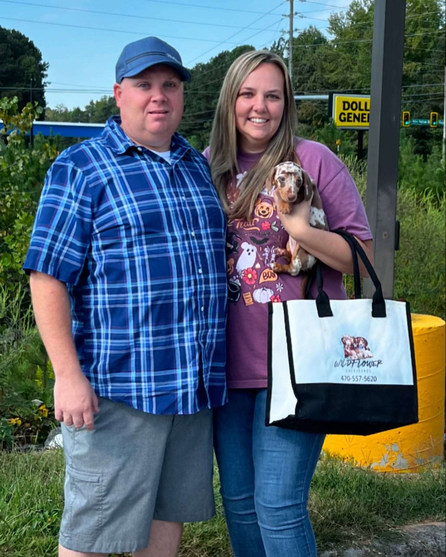 Happy family with their Dachshund puppy