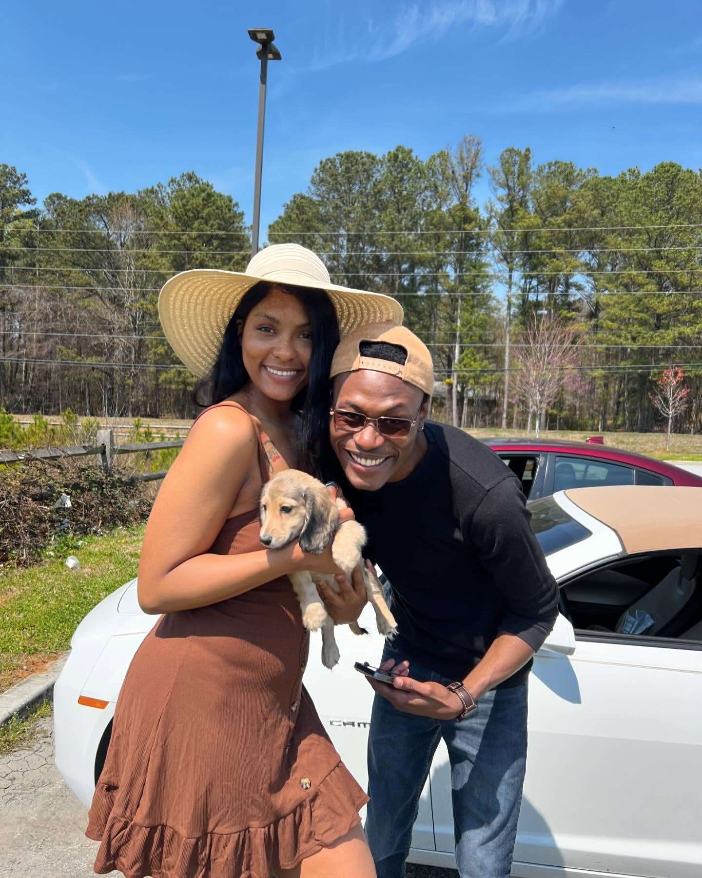 Happy family with their Dachshund puppy