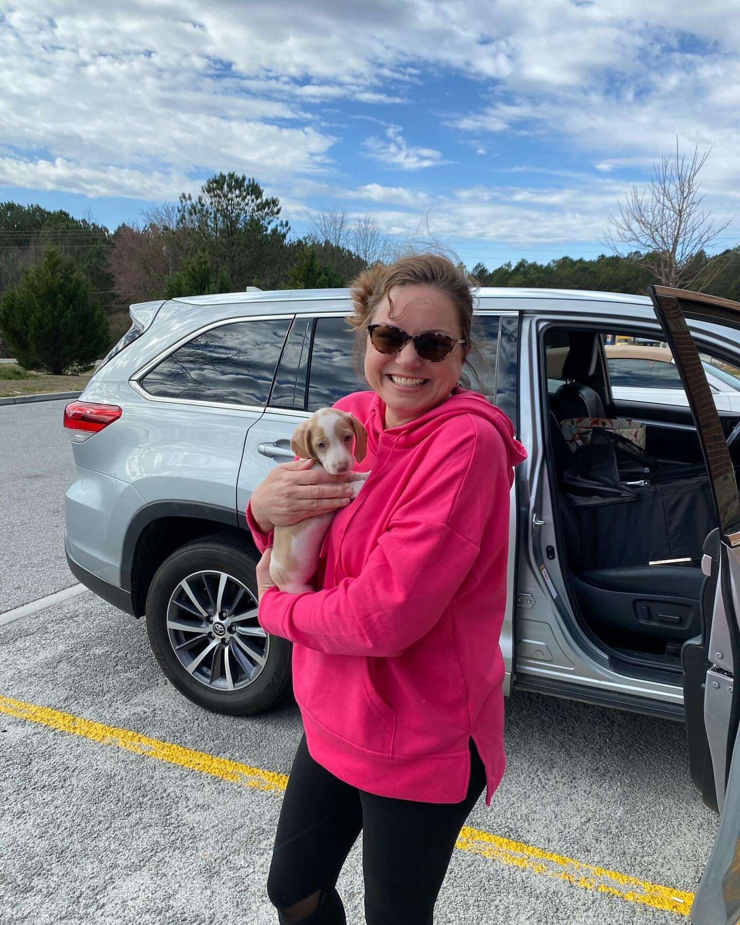 Happy family with their Dachshund puppy