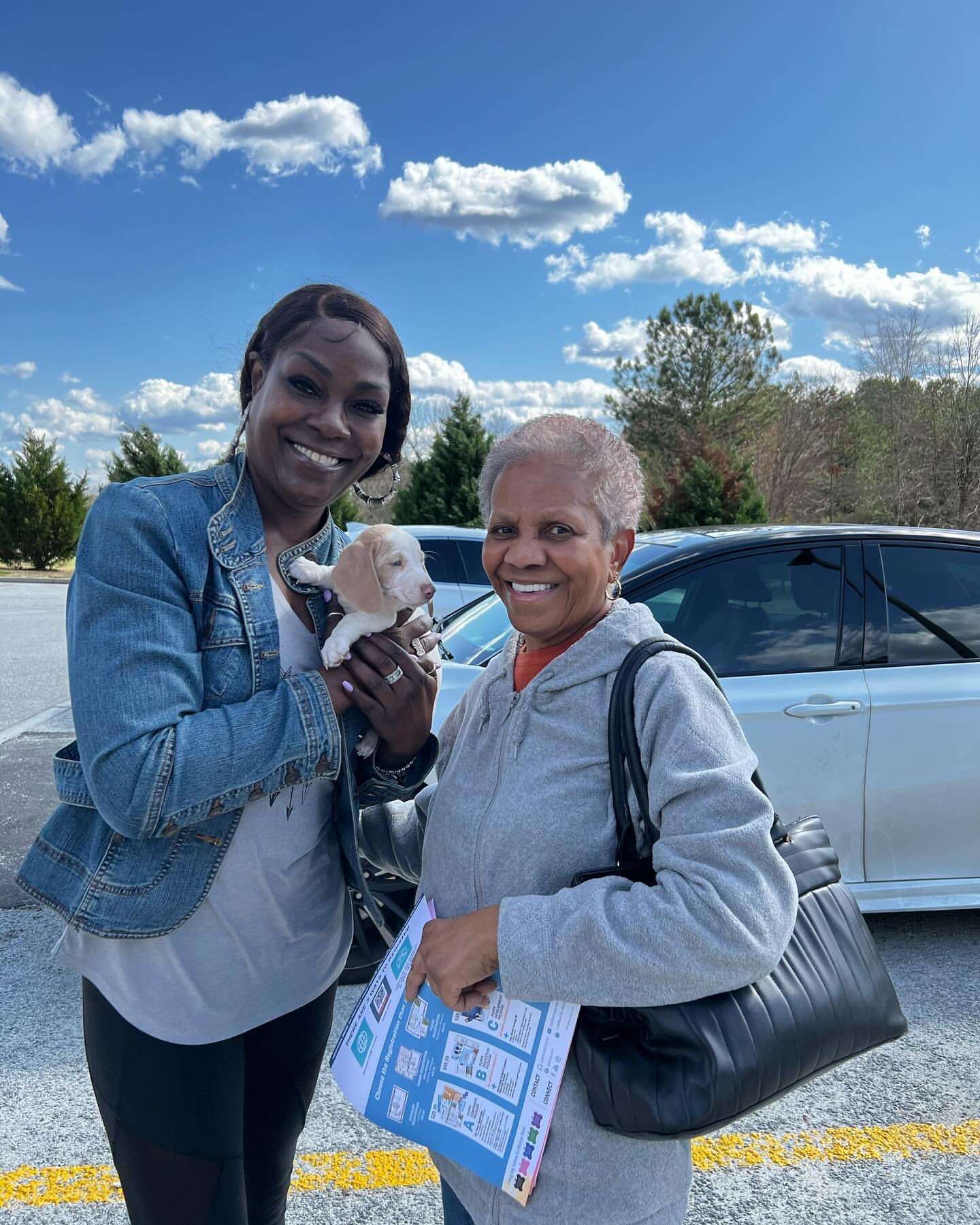 Happy family with their Dachshund puppy