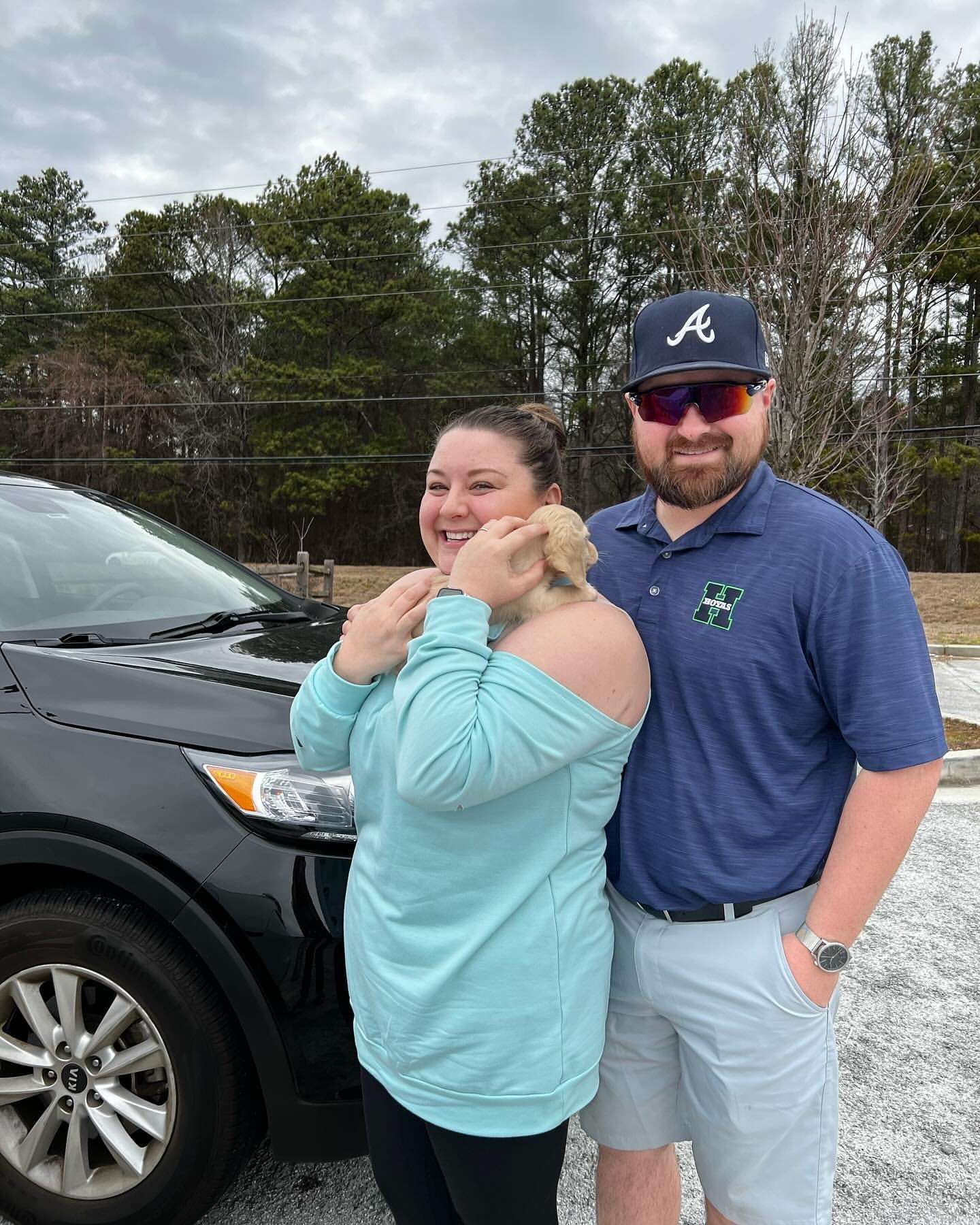Happy family with their Dachshund puppy
