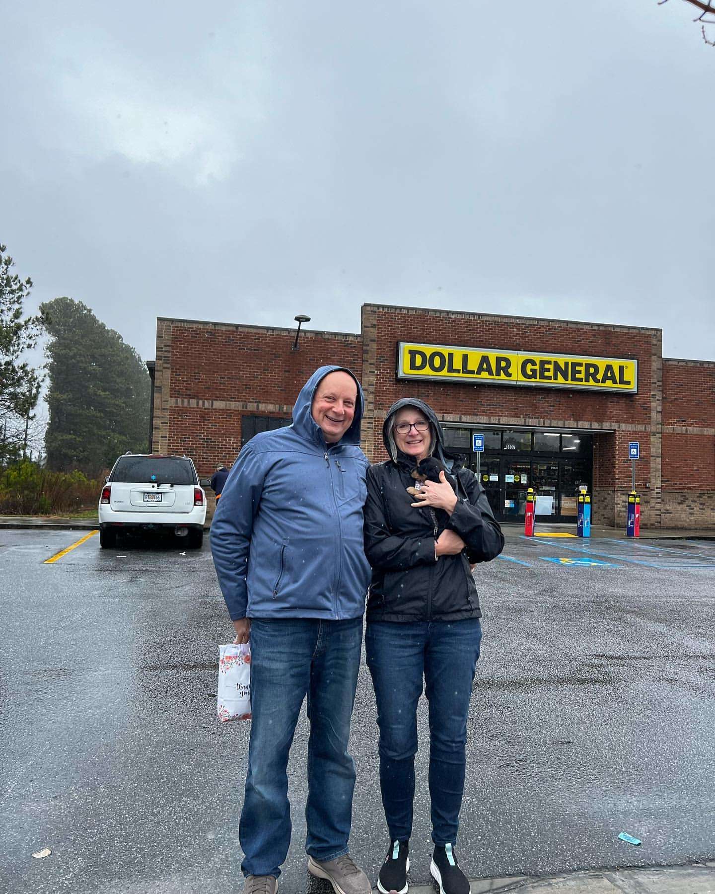 Happy family with their Dachshund puppy