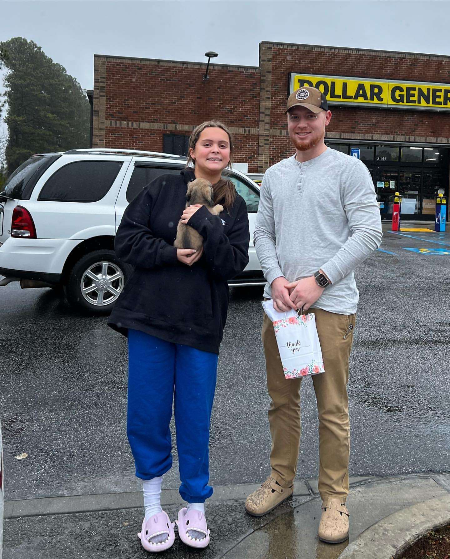 Happy family with their Dachshund puppy