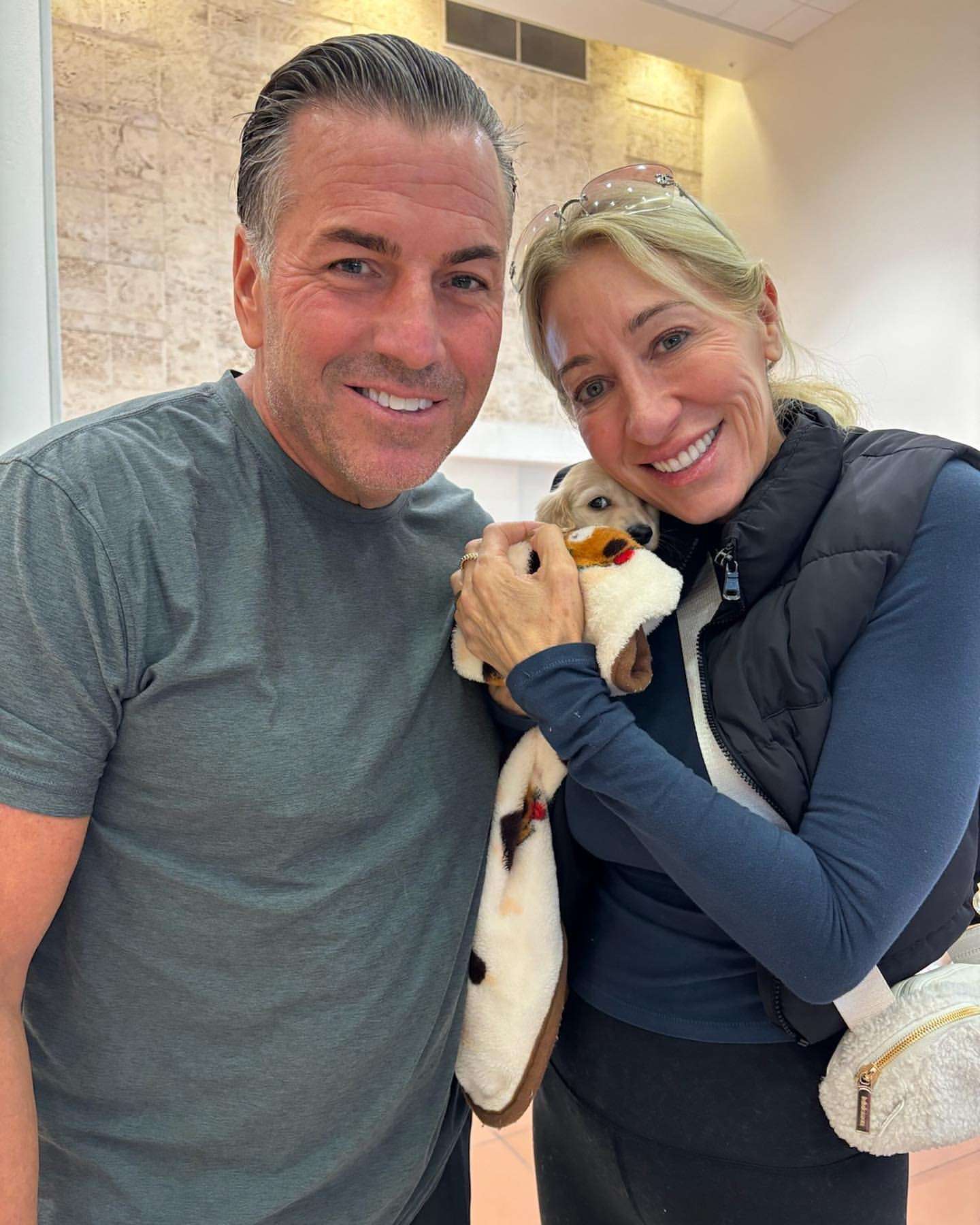 Happy family with their Dachshund puppy