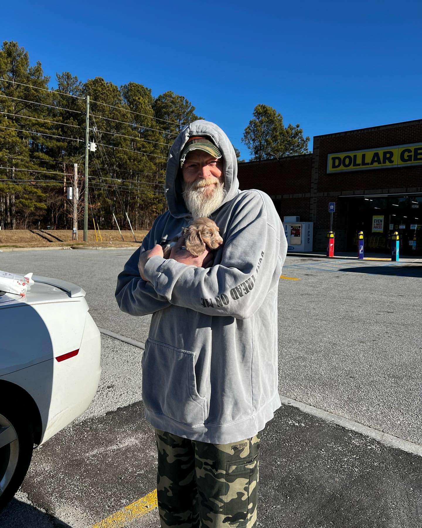 Happy family with their Dachshund puppy