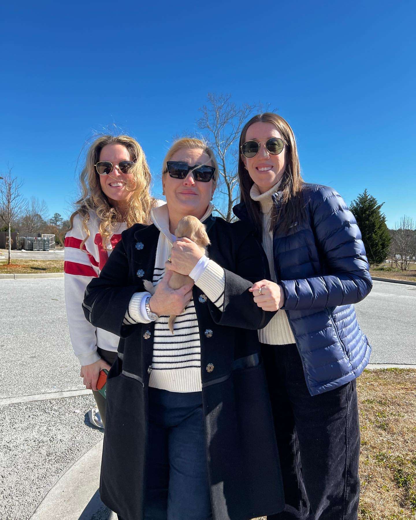 Happy family with their Dachshund puppy