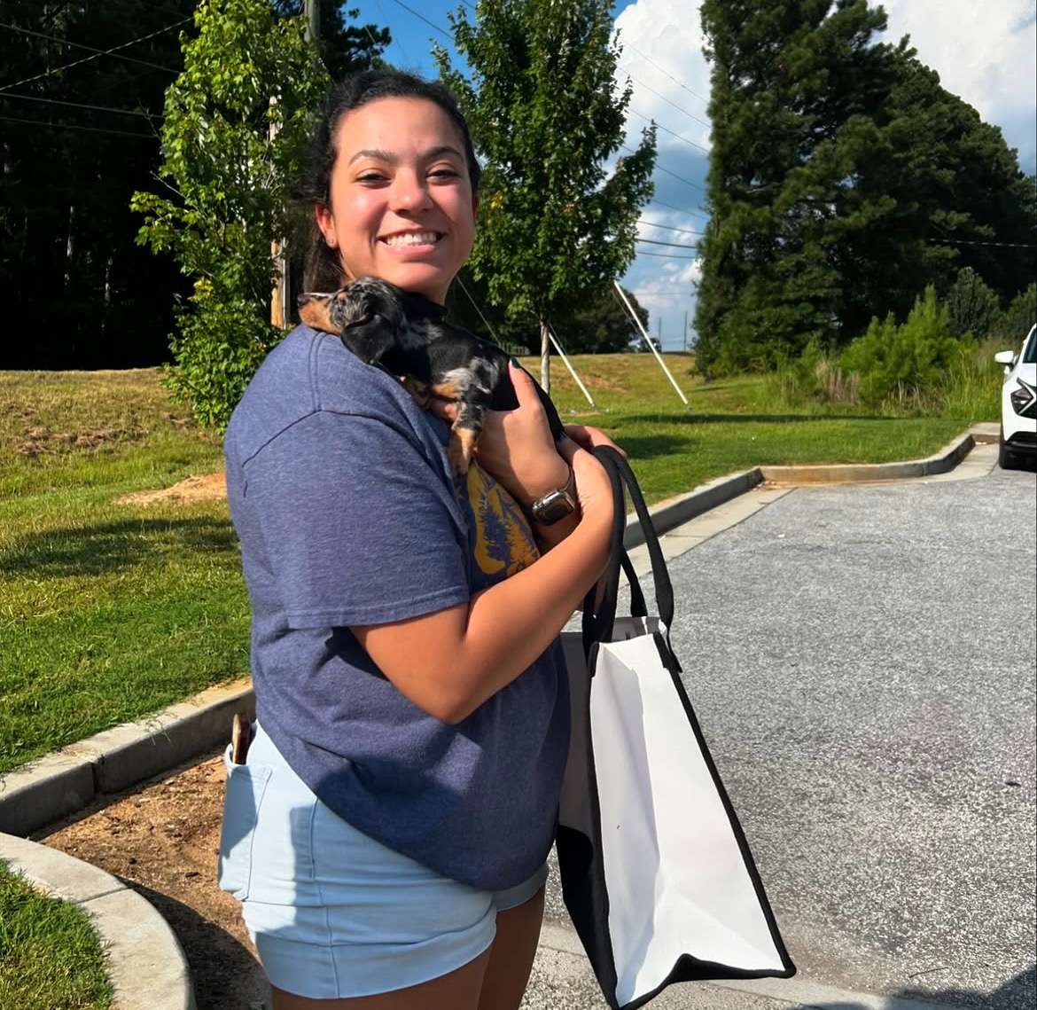 Happy family with their Dachshund puppy