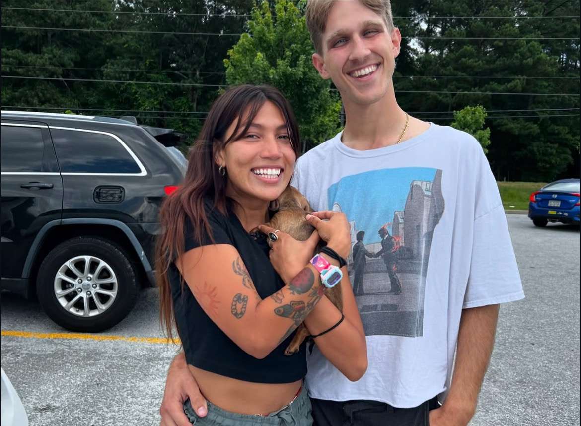 Happy family with their Dachshund puppy