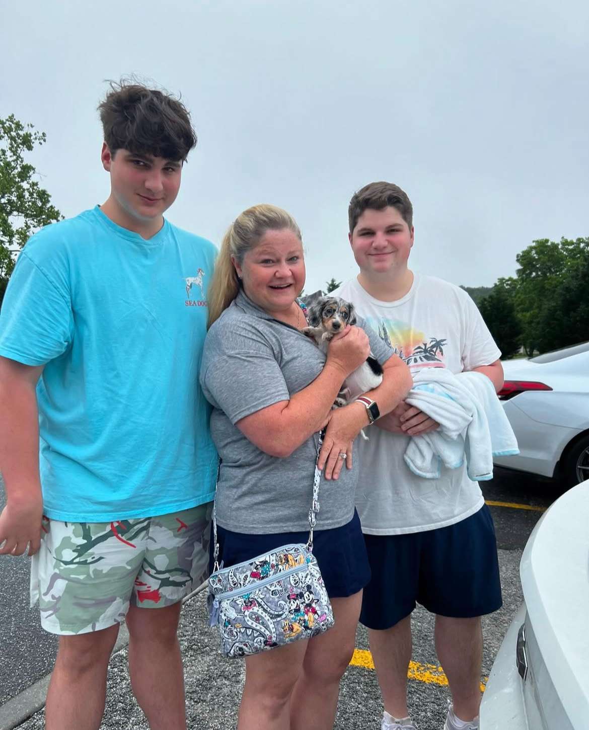 Happy family with their Dachshund puppy