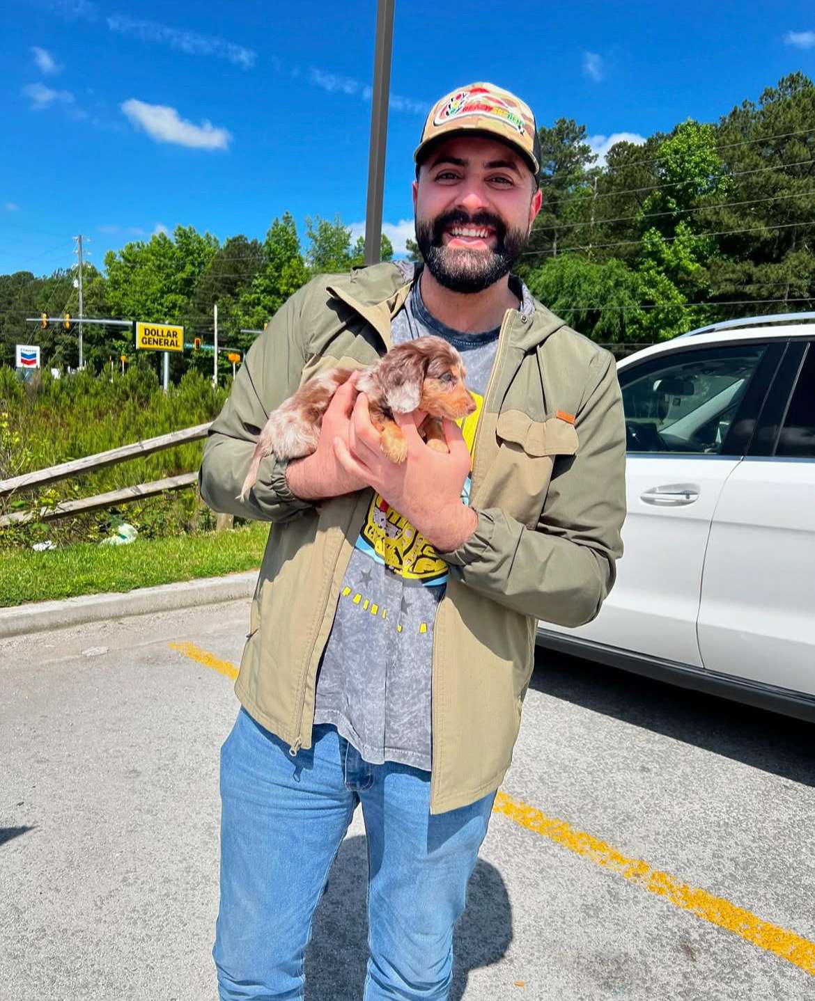 Happy family with their Dachshund puppy